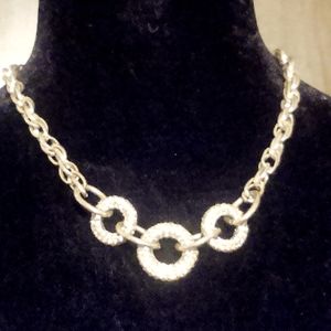 Gold tone chain link necklace. Adjustable 19" to 23".